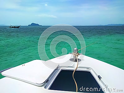 Sunny day at anchor fishing boat in sea, Thailand Stock Photo