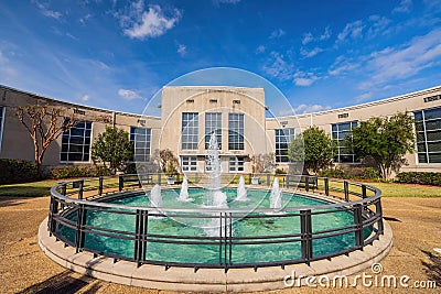 Sunny exterior view of a fountain and Louisiana State Exhibit Museum Editorial Stock Photo