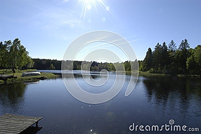 Sunny Lake with Boat Ramp Stock Photo