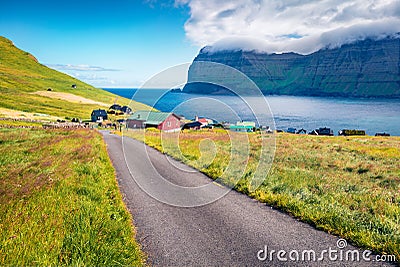 Sunny morning view of Mikladalur villagr, Kalsoy island. Bright summer scene of Faroe Islands, Denmark, Europe. Fantastic seascape Stock Photo