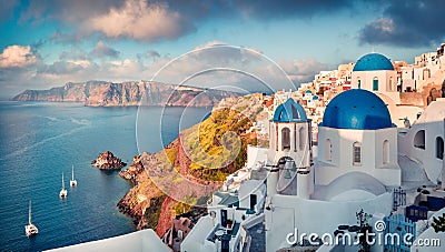 Sunny morning view of Santorini island. Picturesque spring sunrise on the famous Greek resort Oia, Greece, Europe. Stock Photo