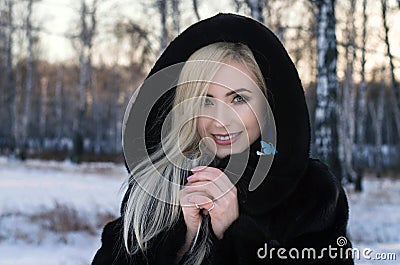 Sunny outdoor winter portrait of young attractive woman Stock Photo