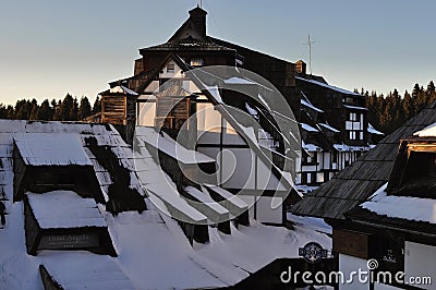 Sunny peaks under snow tourist complex Editorial Stock Photo