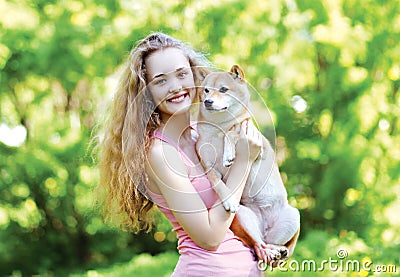 Sunny portrait charming pretty girl and her loving dog outdoors Stock Photo