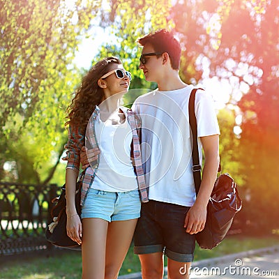 Sunny portrait of happy young couple teenagers in urban style Stock Photo