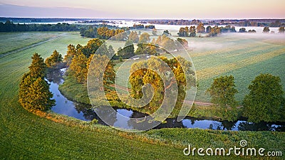 Sunny summer calm morning panorama. Small river, fog sunrise aerial view Stock Photo