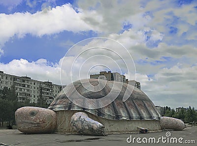 a huge inflatable turtle is depicted against a blue sky. Editorial Stock Photo