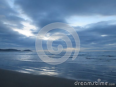Start of a new day at Wainui beach, New Zealand Stock Photo