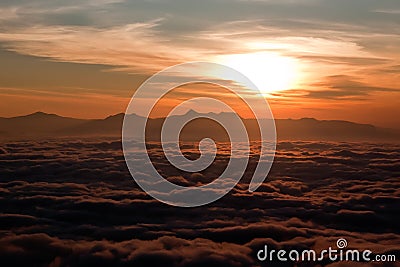 Sunrise above clouds Stock Photo