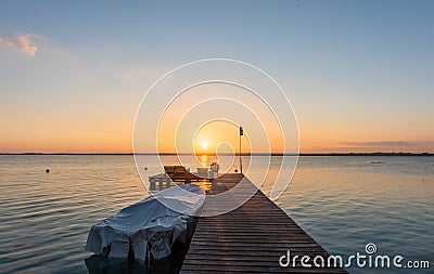 Sunrise on the boardwalk in Bacalar, Mexico Stock Photo