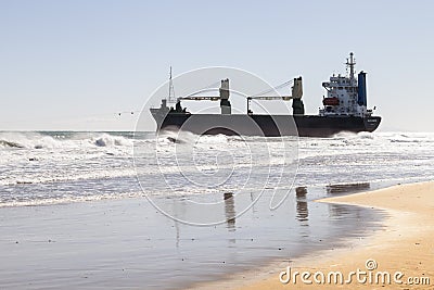 Sunrise boat stuck on the Mediterranean coast Editorial Stock Photo