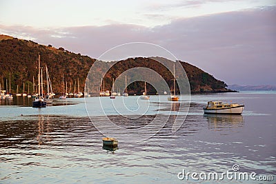 Sunrise and boats in the harbour of Mangonui, New Zealand Editorial Stock Photo