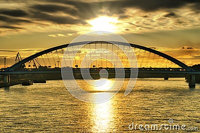Sunrise in Bratislava over Apolo bridge and Danube river, Slovakia Stock Photo