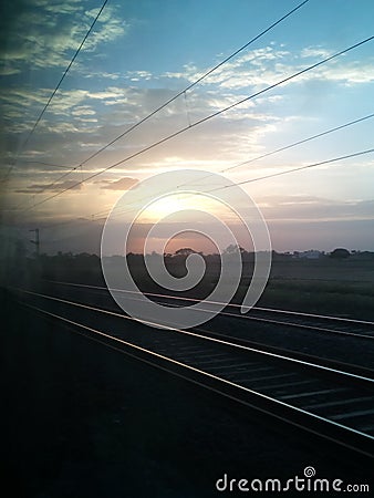 Sunrise captured from running Indian railway couch Stock Photo