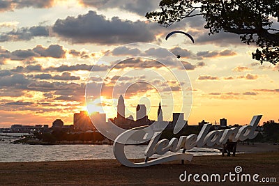 Sunrise with Cleveland skyline, Lake Erie, and paraglider Editorial Stock Photo