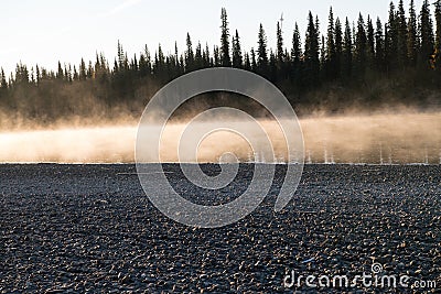 sunrise after a cold night at the Pelly river - Yukon Stock Photo