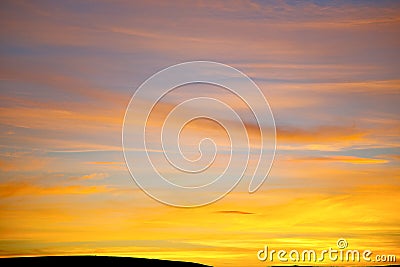 Sunrise in the colored sky soft clouds abstract background Stock Photo