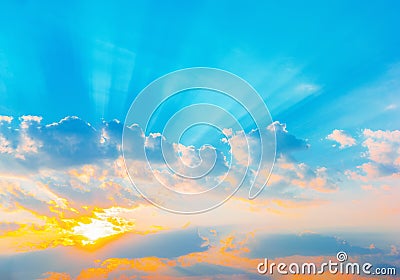 Sunrise dramatic blue sky with orange sun rays breaking through the clouds. Nature background. Hope concept Stock Photo