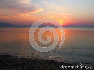 Sunrise at the empty beach. Stock Photo