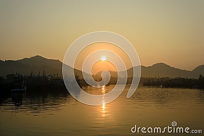 Sunrise and fishing boat at Khanom beach Stock Photo