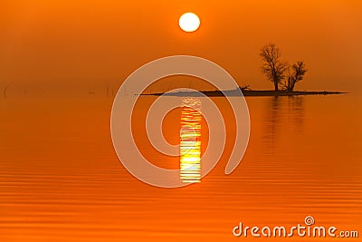 Sunrise Fog on Truman Lake with an Island Stock Photo