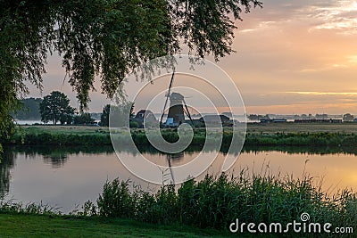 Sunrise and fogg over the meadows of the Zwanburgerpolder Stock Photo