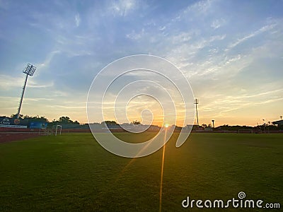 Sunrise at the football field Stock Photo