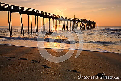 Sunrise and footprints on the Outer Banks, North Carolina Stock Photo