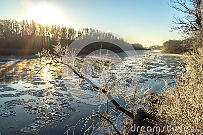 Sunrise during freeze-up in the river Stock Photo