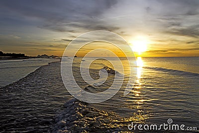 Sunrise golden on wave Stock Photo