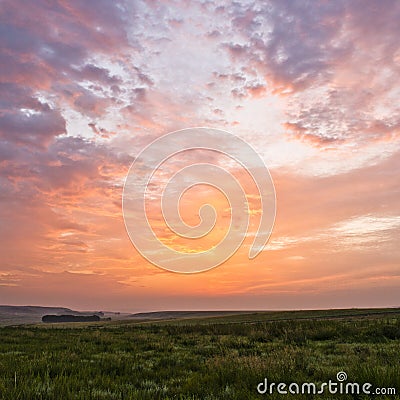 Sunrise and grassland Stock Photo