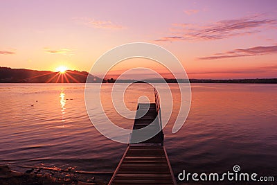 Sunrise by a lake inspiring relax and quietness Stock Photo