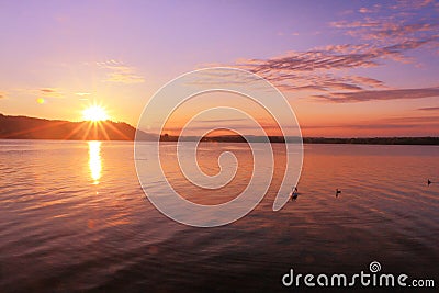 Sunrise by a lake inspiring relax and quietness Stock Photo