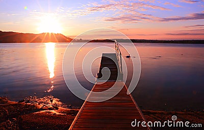 Sunrise by a lake inspiring relax and quietness Stock Photo