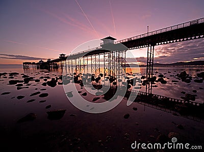 Sunrise at Llandudno pier Stock Photo