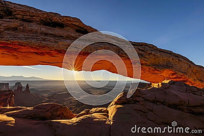 Sunrise In Mesa Arches National Park, with an arch silhouette Stock Photo