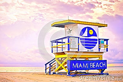 Sunrise in Miami Beach Florida, with a colorful lifeguard house Stock Photo
