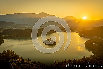 Orange sunset over the Bled lake in Slovenia Stock Photo