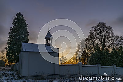 Sunrise near Ctibor and Halze villages in cold snowy morning with chapel Stock Photo