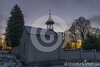 Sunrise near Ctibor and Halze villages in cold snowy morning with chapel Stock Photo