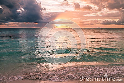 Sunrise over the Caribbean Beach and Ferry Boat, Mexico Stock Photo