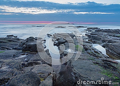 Sunrise over Coquet Island Stock Photo