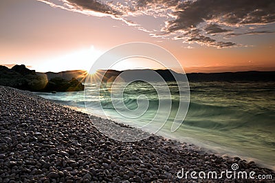 Sunrise over the crystal clear tourquise sea in Croatia, Istria, Europe Stock Photo