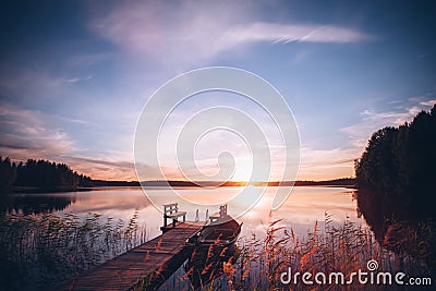 Sunrise over the fishing pier at the lake in Finland Stock Photo