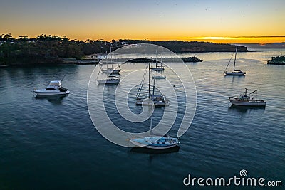 Sunrise over the harbour with low cloud bank and boats Editorial Stock Photo