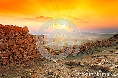 Sunrise over Masada fortress Stock Photo