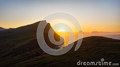 Sunrise over the mountains and Ocean Stock Photo
