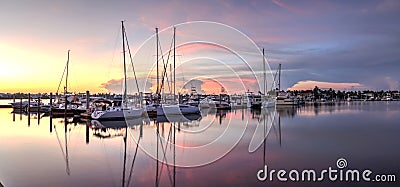 Sunrise over a quiet harbor in old Naples, Florida Stock Photo