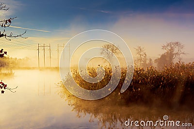 Sunrise over the river morning fog forest Stock Photo