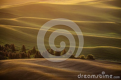 Sunrise over rolling country hills Stock Photo